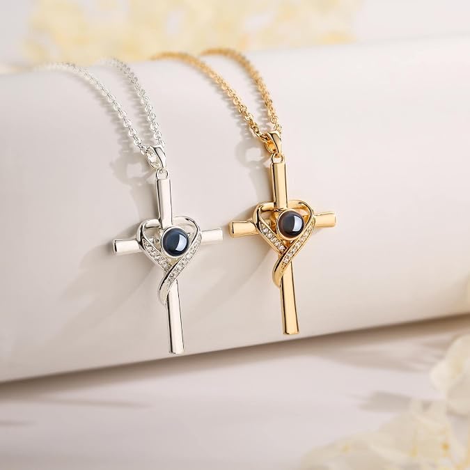 Gold-tone Isaiah 41:10 projection cross necklace on a soft floral background