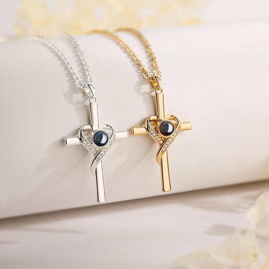 Gold-tone Isaiah 41:10 projection cross necklace on a soft floral background